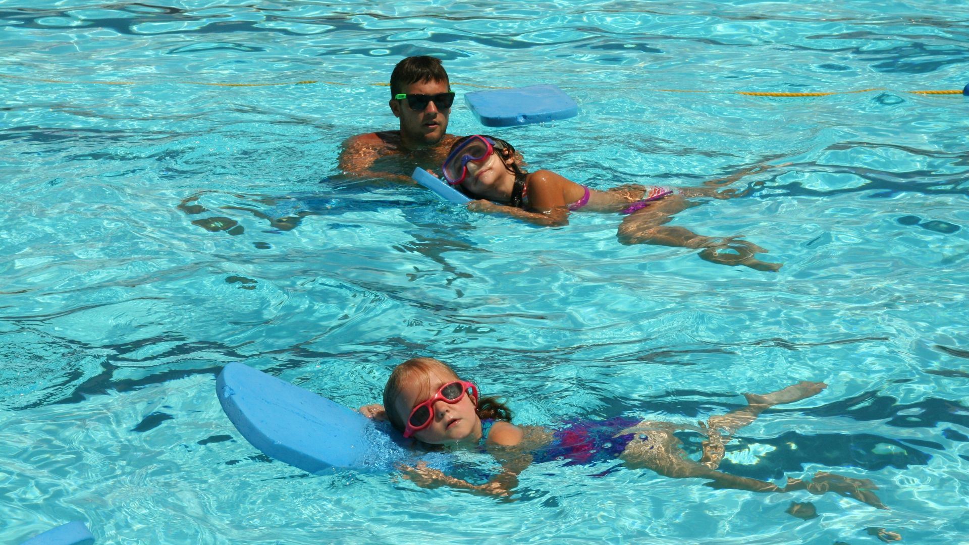 Photo of Instructor Teaching Swimming Lessons